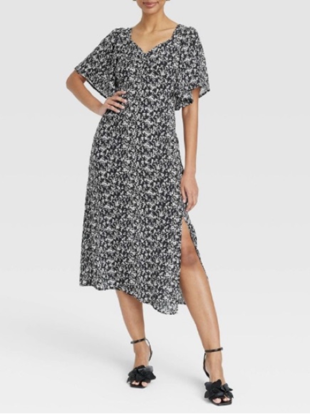 A new day Black and White Floral Midi Dress with Flutter Sleeves. Size small